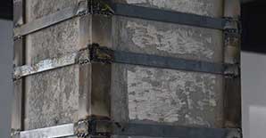 对混凝土梁、柱粘钢加固方案的讨论